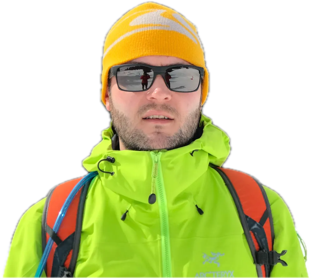 Tom Thorns in a green jacket and a yellow hat
